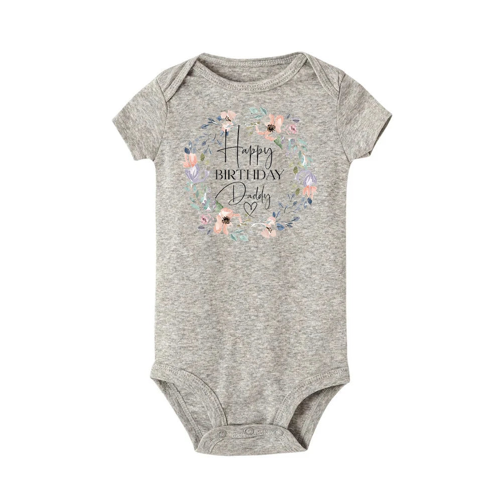 Gray short-sleeve baby bodysuit with "Happy Birthday Daddy" in a floral wreath design.
