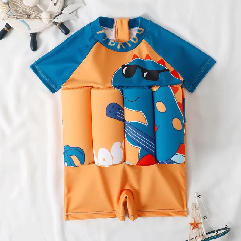 Orange and blue kids' floatation swimsuit with a cool cartoon dinosaur print and short sleeves.