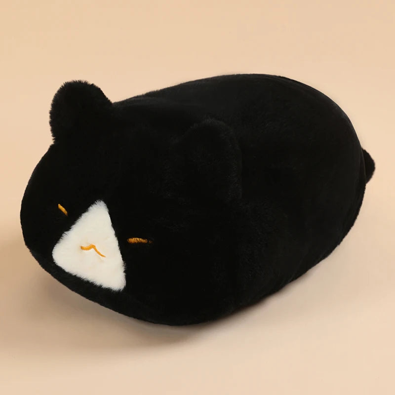 Soft black plush cat pillow, 45cm, with white face patch and embroidered closed eyes.