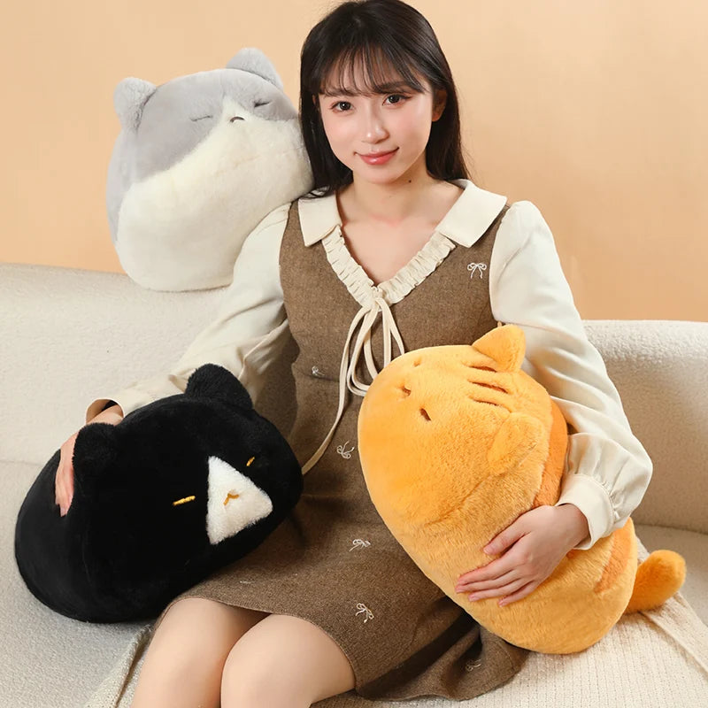 Woman with three soft cat plush pillows: gray, black, and orange striped, 45cm.