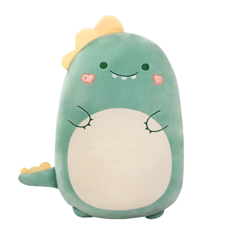 Soft green dinosaur plush pillow for kids, with yellow spikes and a cute smiling face.