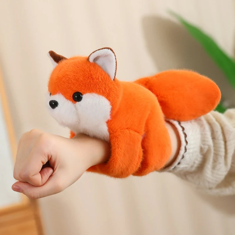 Soft orange plush fox toy, 20cm, with white belly and ears, worn on a hand.