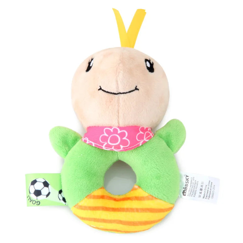 Soft plush baby rattle teether toy with a beige head, green body, pink bandana, and striped yellow ring.