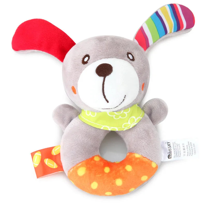 Soft gray plush rabbit baby rattle and teether with colorful ears, green bandana, and orange polka-dot base.