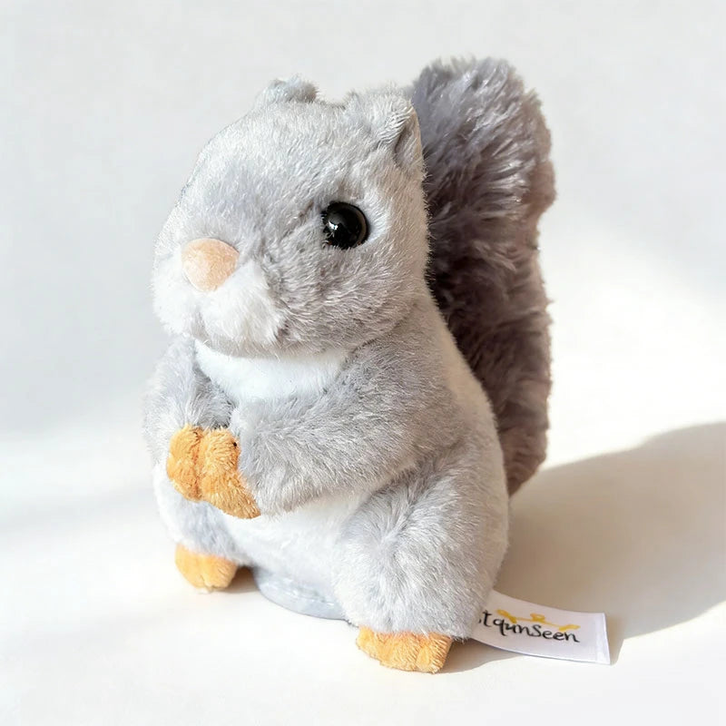 Cute gray plush magnetic squirrel toy with fluffy tail and orange paws.