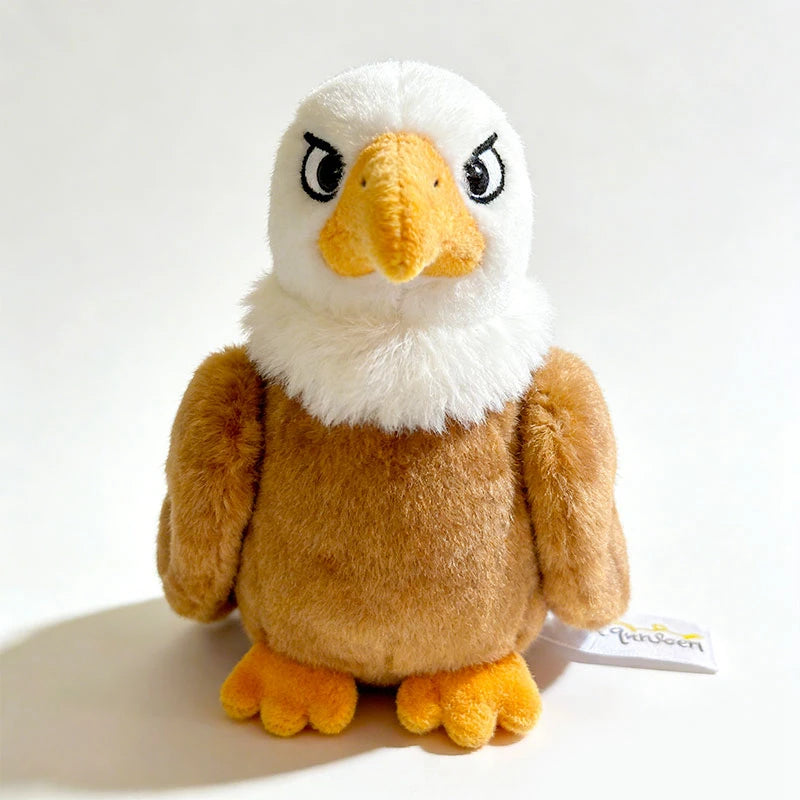 Plush magnetic shoulder eagle toy with white head, yellow beak, and brown body.