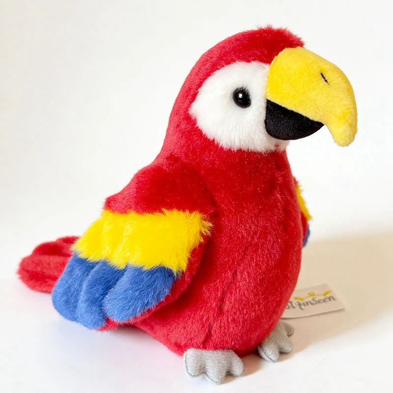 Red plush magnetic parrot toy with yellow beak, blue wings, and white face.