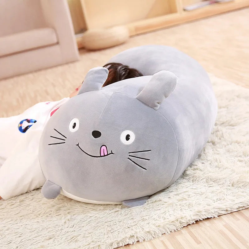 Soft grey cartoon animal plush pillow, 90cm, with embroidered face and ears, on a white rug.