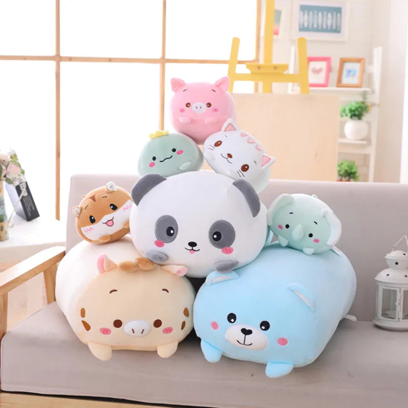 Assortment of soft plush animal pillows including a panda, pig, cat, hamster, elephant, and blue bear.