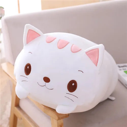 Soft white plush cat stuffed animal with pink ears and stripes, brown eyes, and a gentle smile.