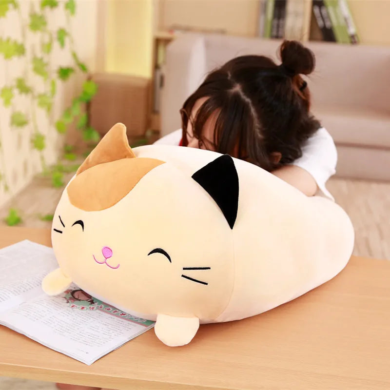 Soft, plush cream and orange cat stuffed animal with black ears, perfect for babies.