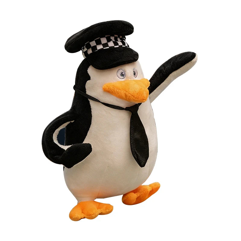 Soft 28cm Madagascar plush penguin toy in a black police hat and tie, with orange beak and feet.