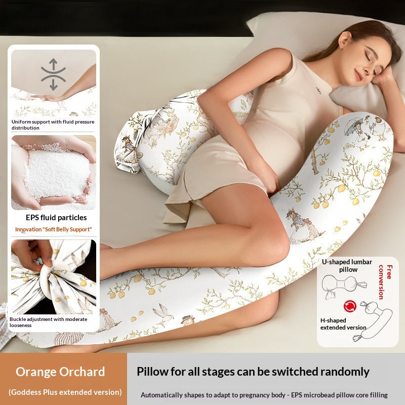 White U-shaped pregnancy pillow with orange orchard pattern, supporting a sleeping pregnant woman.