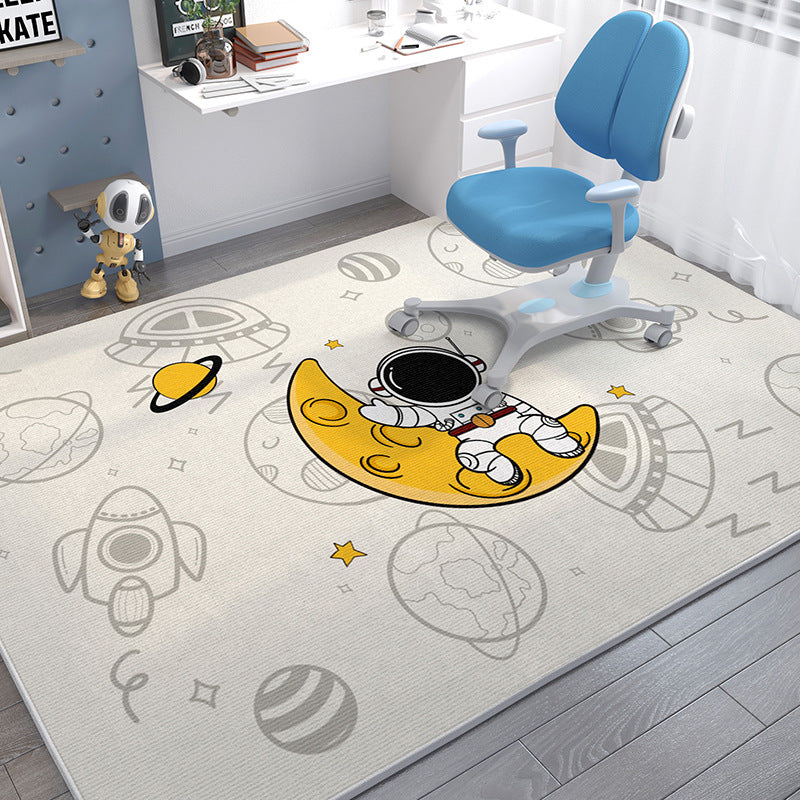 Soft crystal velvet kids' rug with a cartoon astronaut on a yellow moon, rockets, and planets.