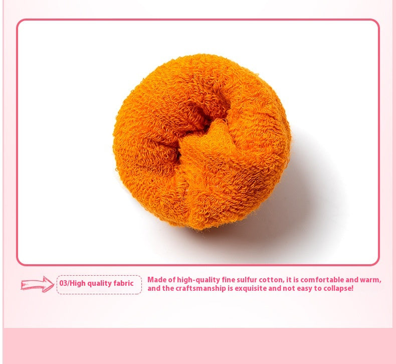 Rolled-up orange high-quality cotton baby sock, showcasing soft, breathable fabric.