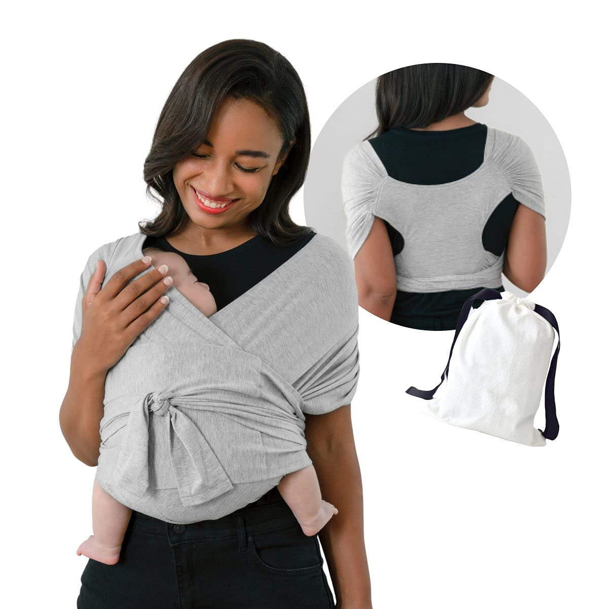 Smiling mother wearing a gray X-type cotton baby carrier with a baby, back view, and storage bag.