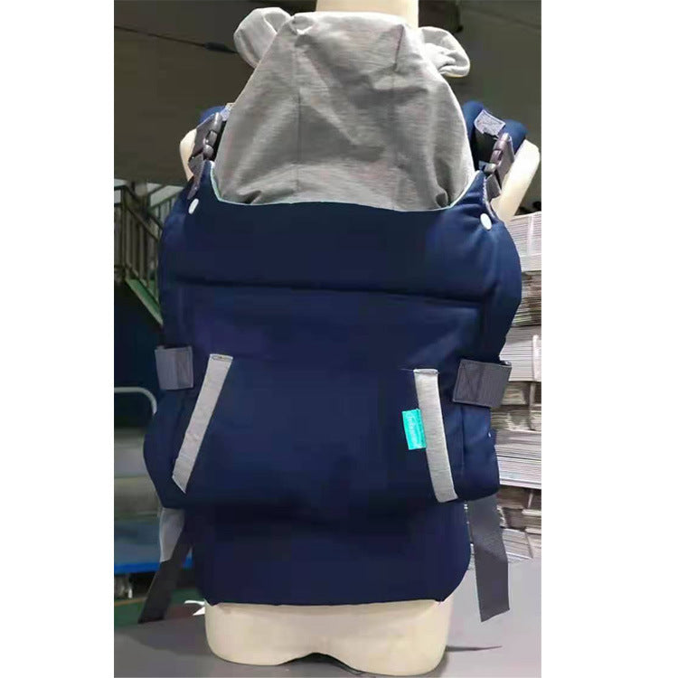 Ergonomic navy blue baby carrier with gray hood and adjustable straps, designed for comfort.