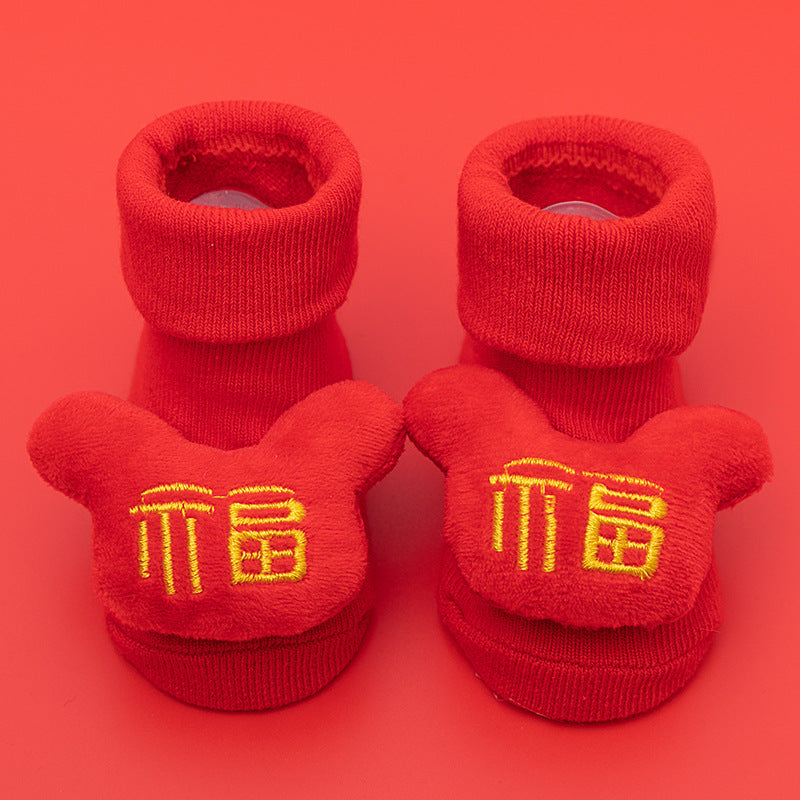 Red cotton baby socks with anti-slip soles and embroidered "Fu" character design.