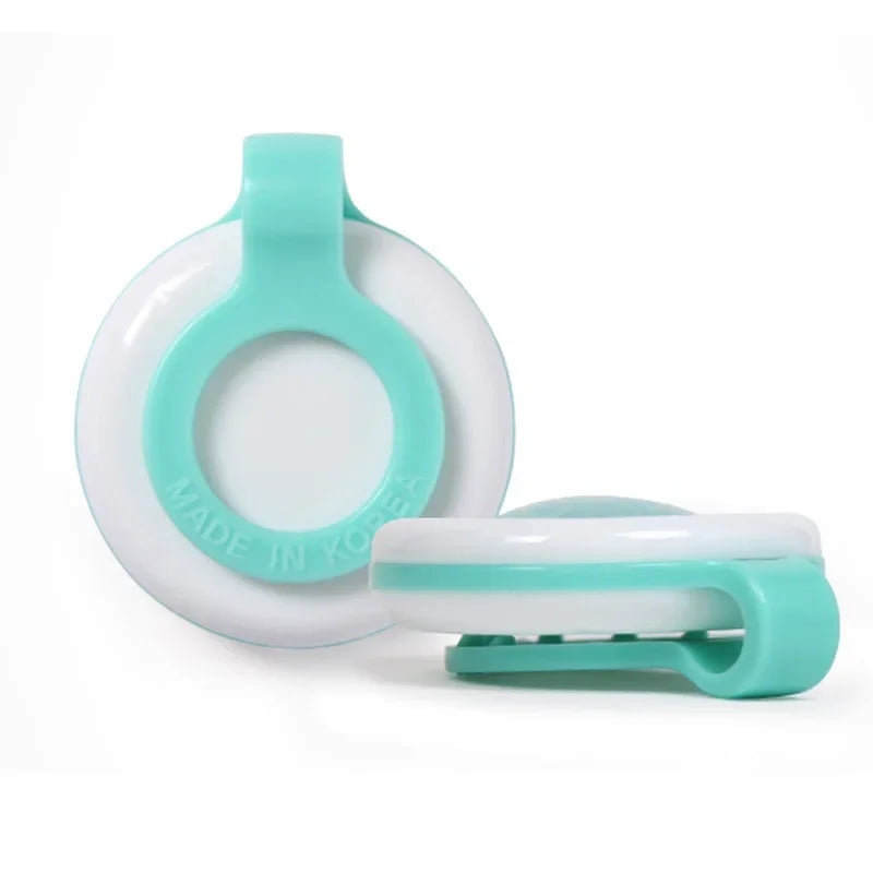 White and mint green natural mosquito repellent clip for baby strollers, made in Korea.