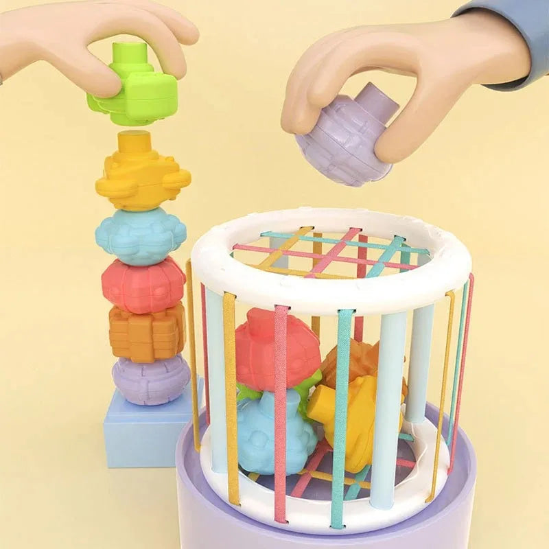 Montessori sorting cube with colorful elastic bands and textured shapes for babies and toddlers.