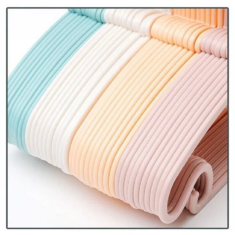 Colorful macaron plastic baby clothes hangers, 29x17cm, with non-slip design for organizing children's wardrobes.