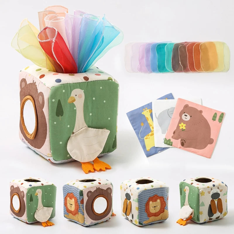 Soft fabric baby tissue box toy with animal designs, sensory scarves, and crinkle squares.