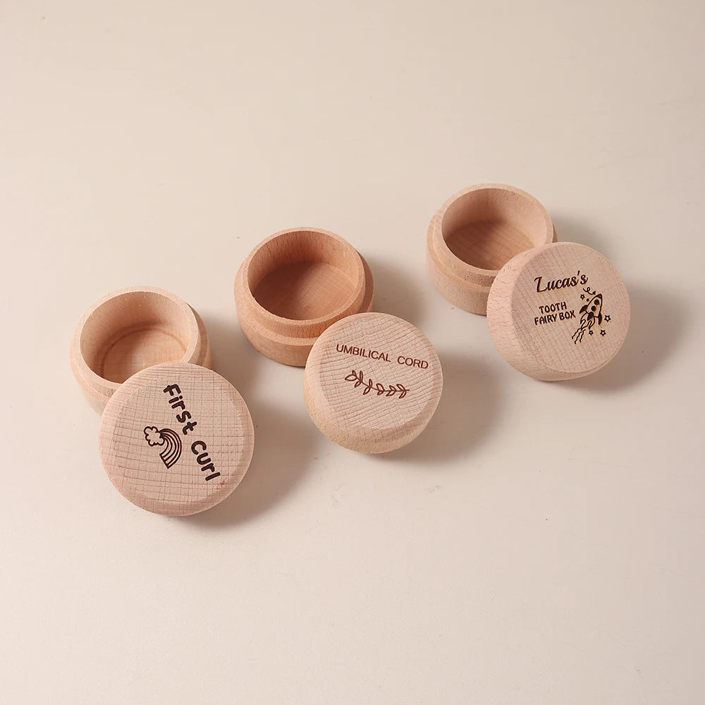 Set of three round natural beechwood baby keepsake boxes with engraved lids for first curl, umbilical cord, and tooth fairy.