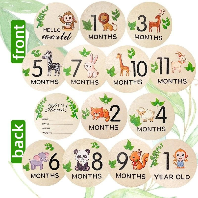 Wooden baby milestone discs with animal designs for monthly photos and birth details.
