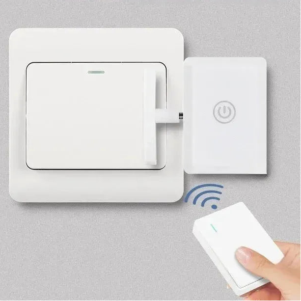 White smart light switch remote control system with a button pusher and a handheld remote.