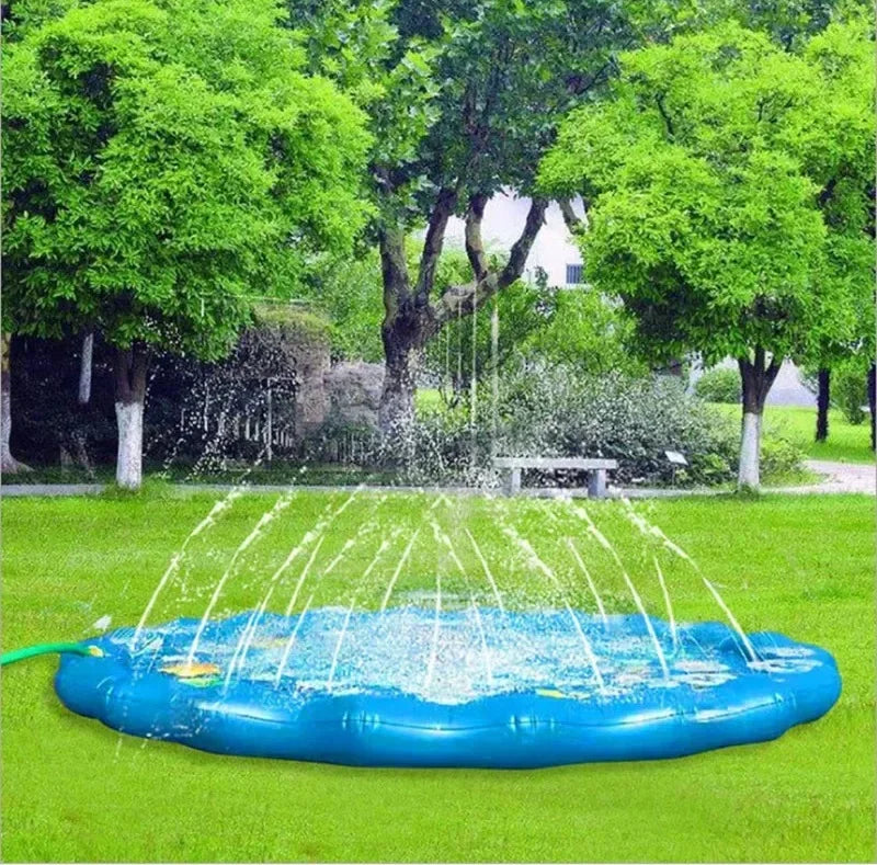 Blue inflatable PVC splash pad for kids, spraying water in a green backyard.