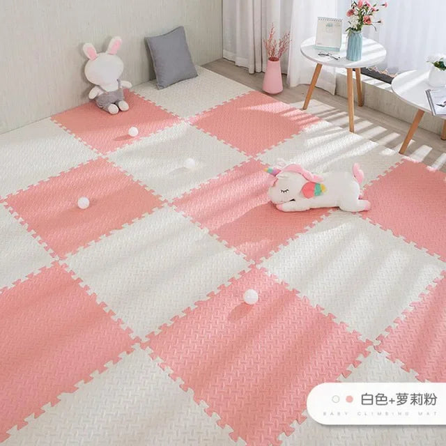 Pink and white interlocking EVA foam puzzle play mat for babies, 16 pieces, with textured surface.