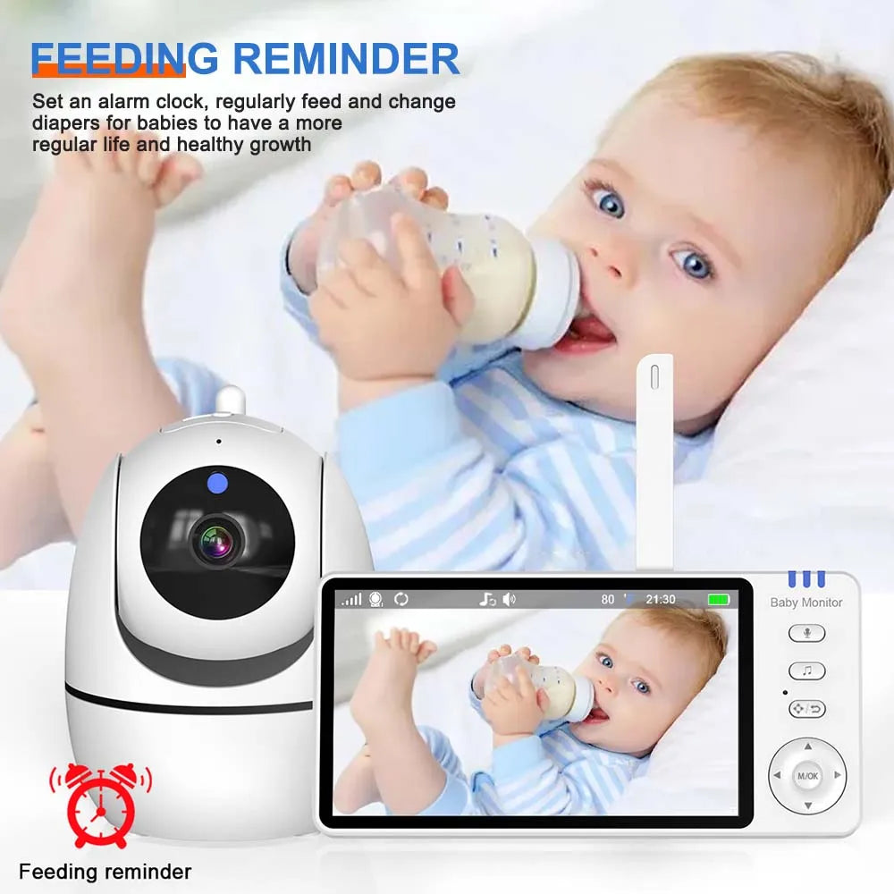 White baby monitor camera and 5-inch HD video screen showing a baby feeding, with a feeding reminder icon.