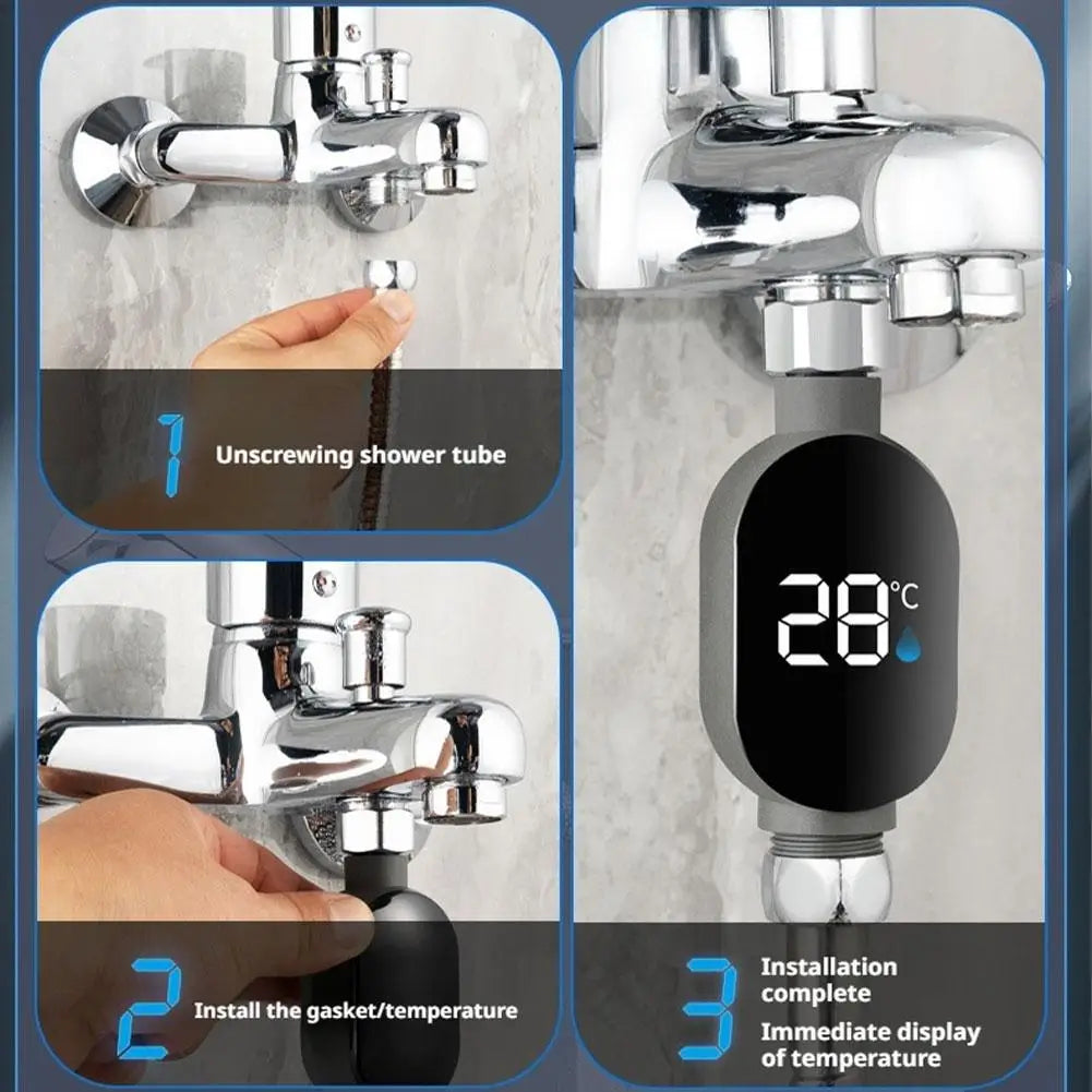 Gray digital shower thermometer with LED display showing 28°C, installed on a chrome shower faucet.
