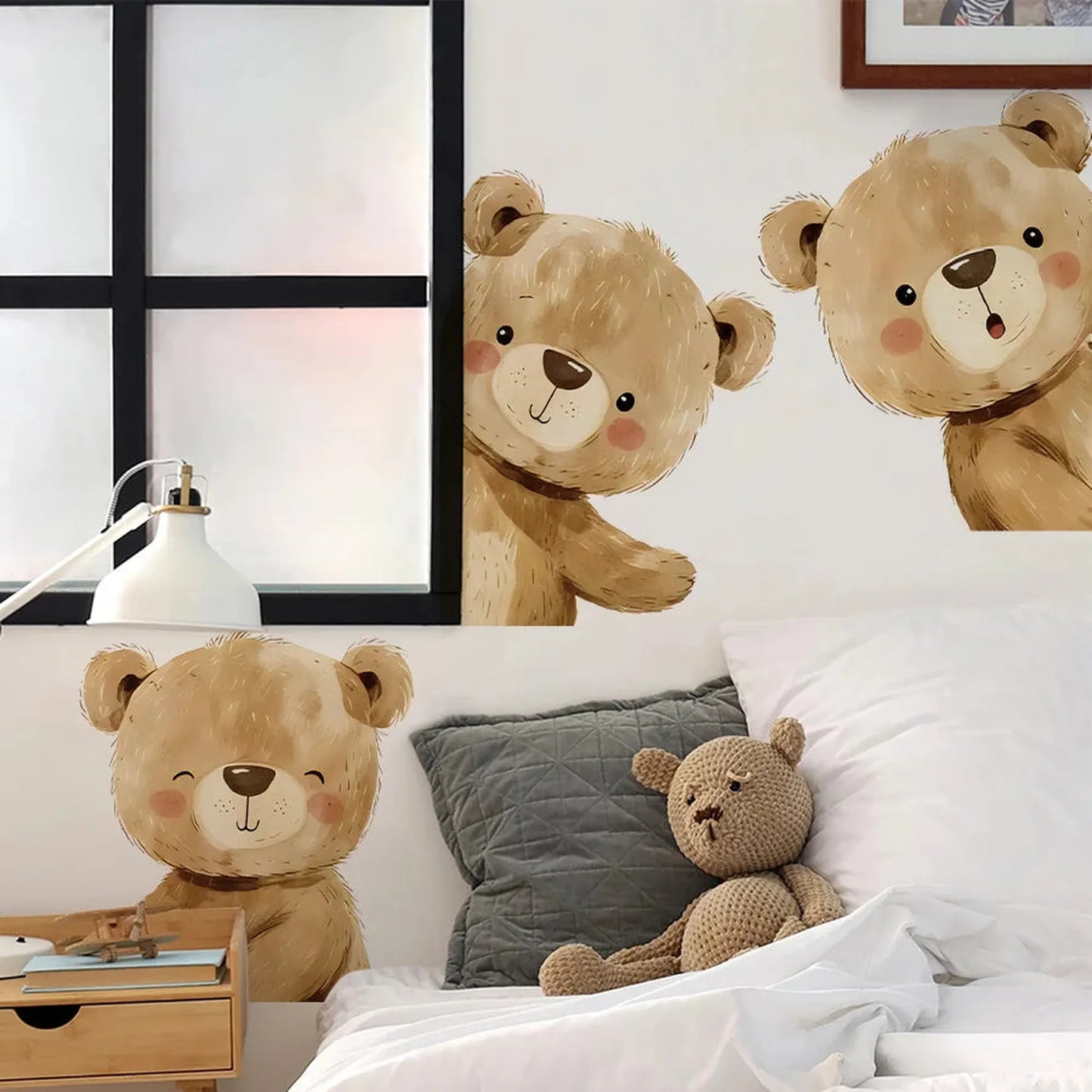 Cute brown teddy bear wall decals peeking around corners in a modern nursery.