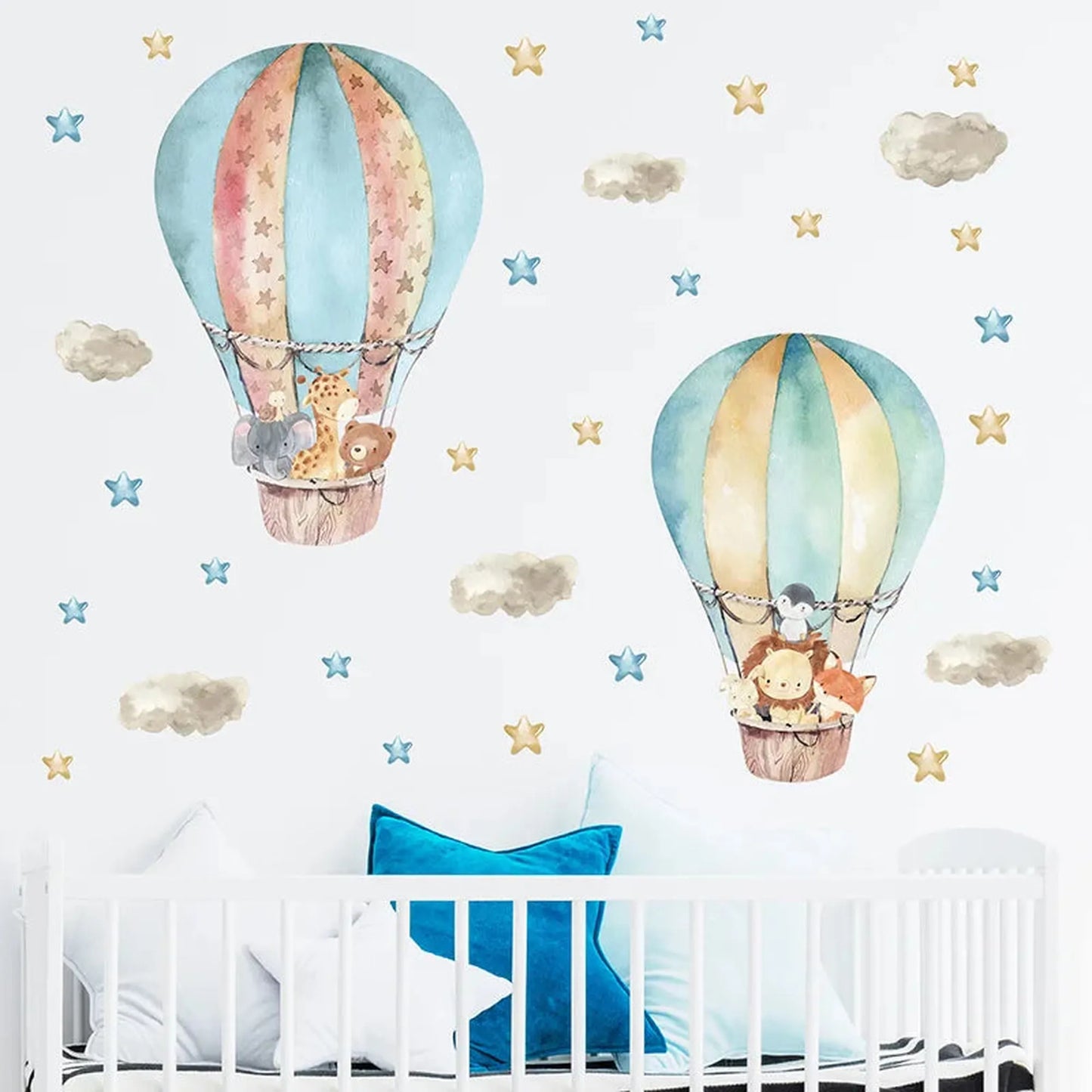 Watercolor hot air balloon wall decals with forest animals, stars, and clouds for a baby nursery.