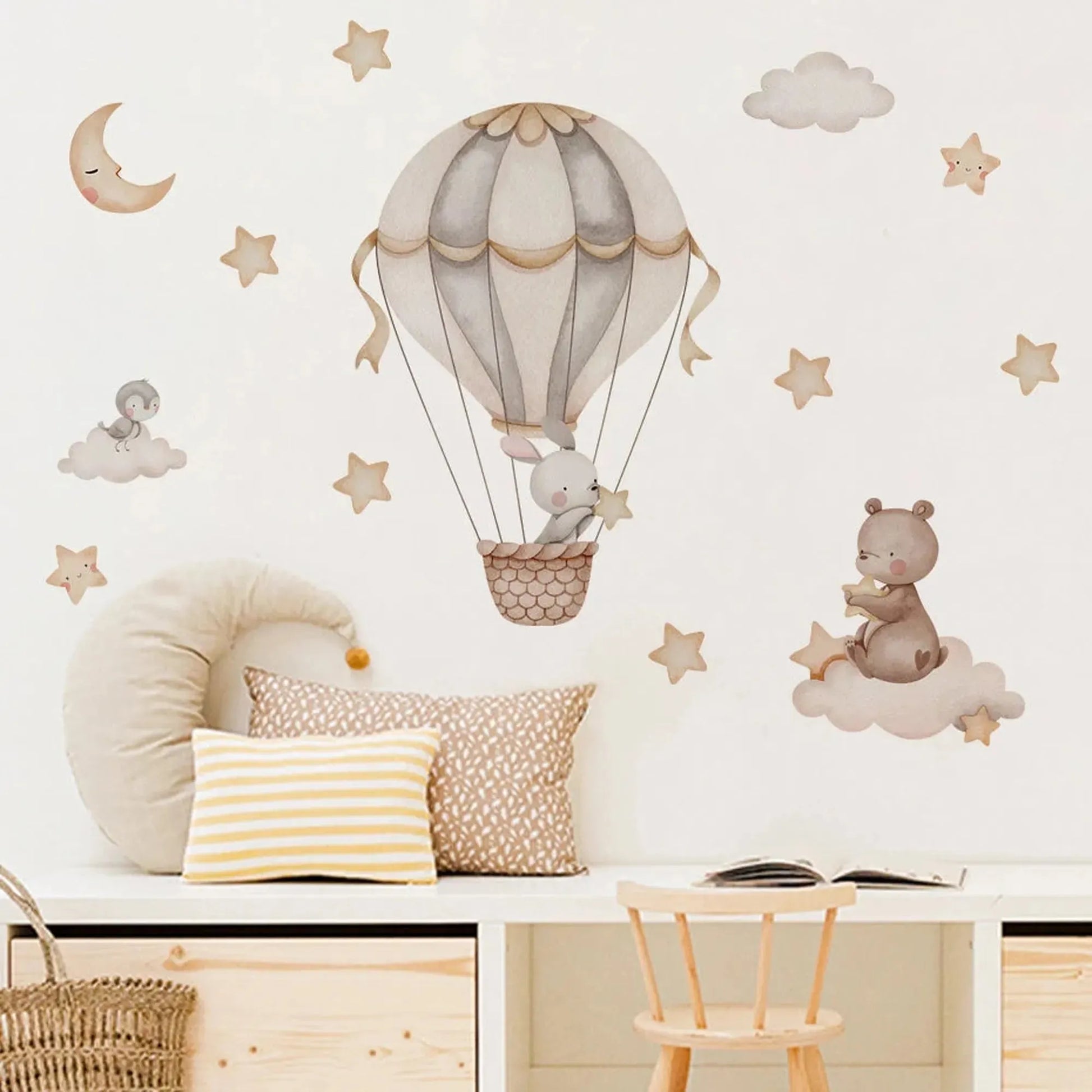Nursery wall decals with a bunny in a hot air balloon, a bear on a cloud, moon, and stars.