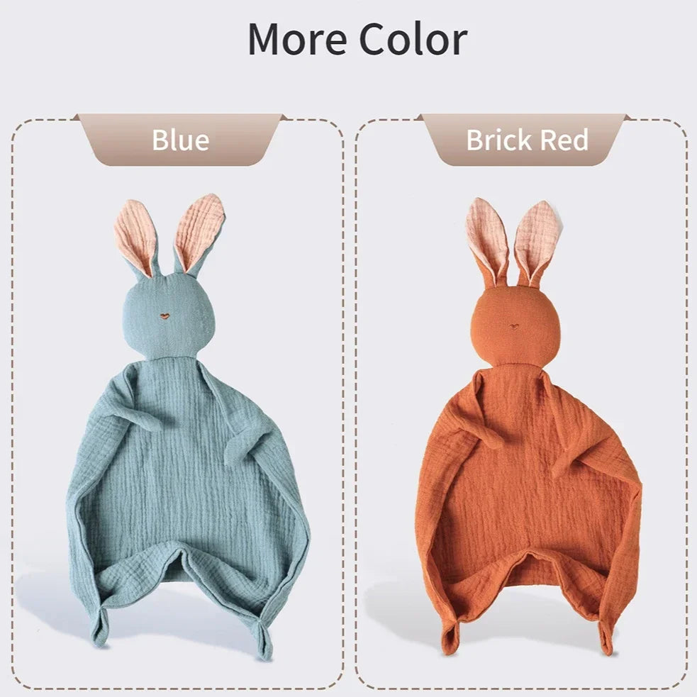 Two muslin baby comforters: a blue bunny and a brick red bunny, both with soft pink ears.