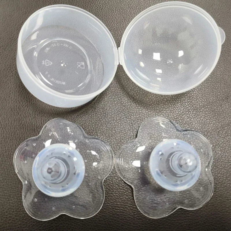 Clear silicone nipple shields with flower-shaped bases and a translucent storage case.