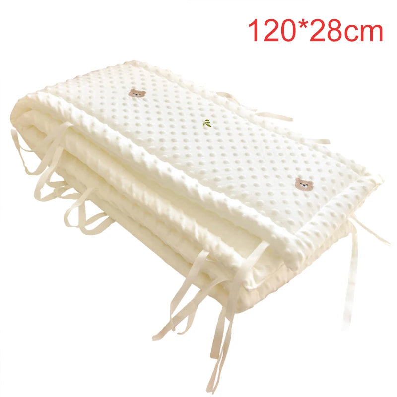 Soft white polyester crib bumper with cute cartoon bear and leaf embroidery, 120x28cm, for baby safety.