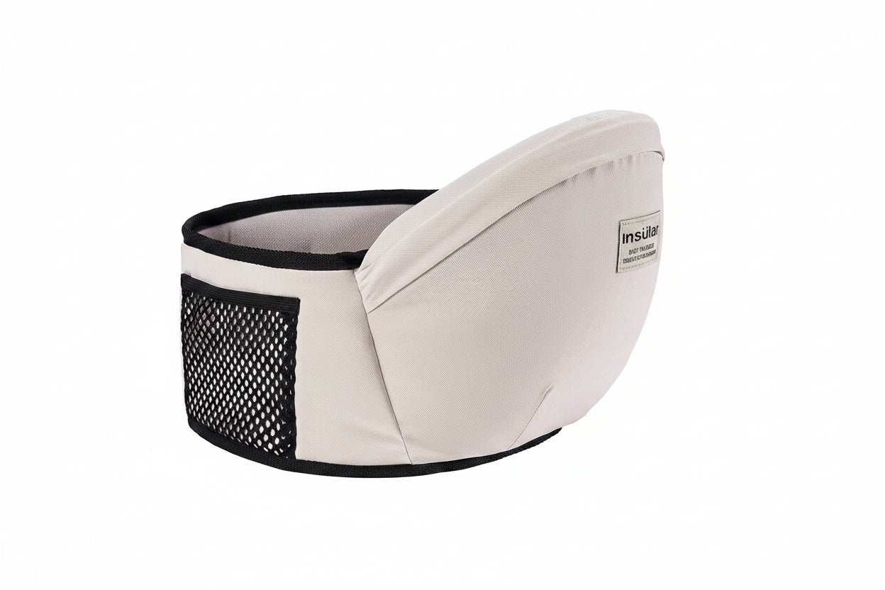 Ergonomic beige baby hip seat carrier with adjustable waist belt and mesh pocket.