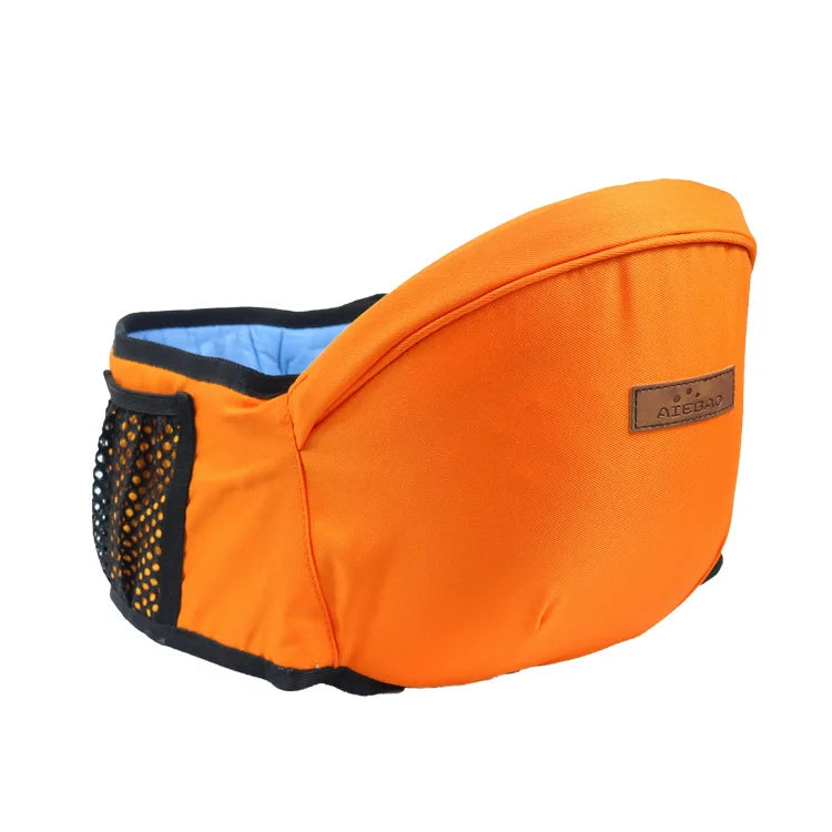 Orange ergonomic baby hip seat carrier with blue lining, mesh pocket, and brown logo patch.