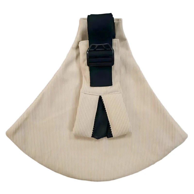 Beige ribbed ergonomic baby carrier with wide black shoulder strap and buckle.