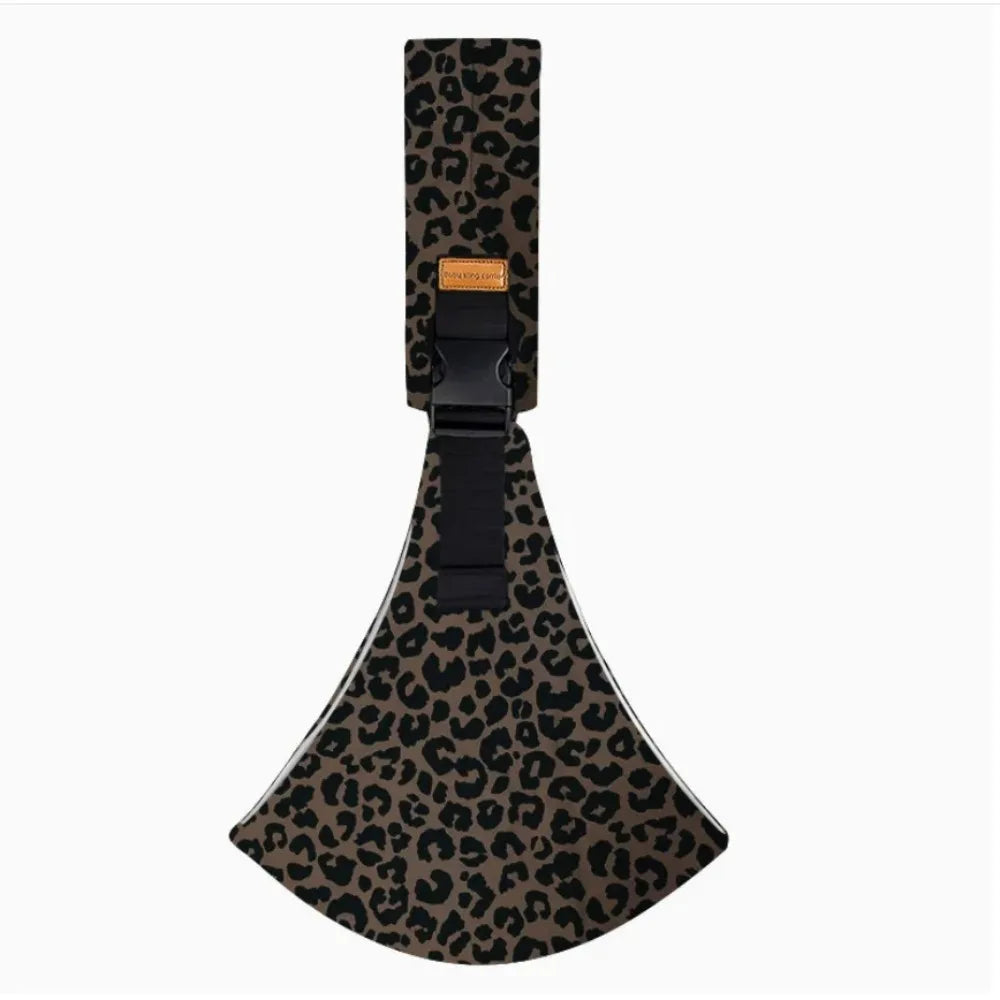 Adjustable cotton baby carrier in a brown and black leopard print, with a black buckle and strap.