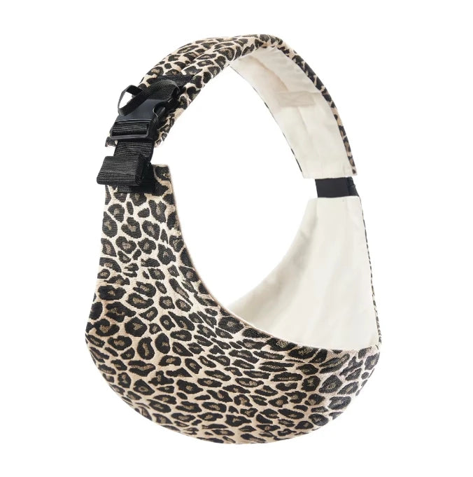 Adjustable cotton baby carrier in leopard print, crossbody wrap style for infants and toddlers.