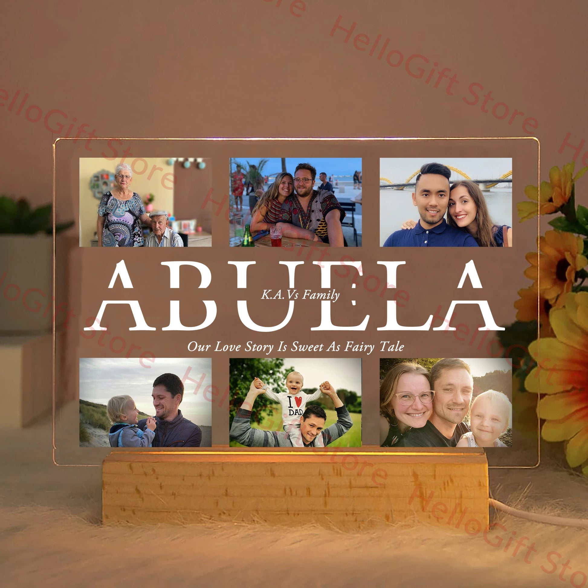 Personalized acrylic LED night light with six custom photos, "ABUELA" text, and a wooden base, glowing warmly.