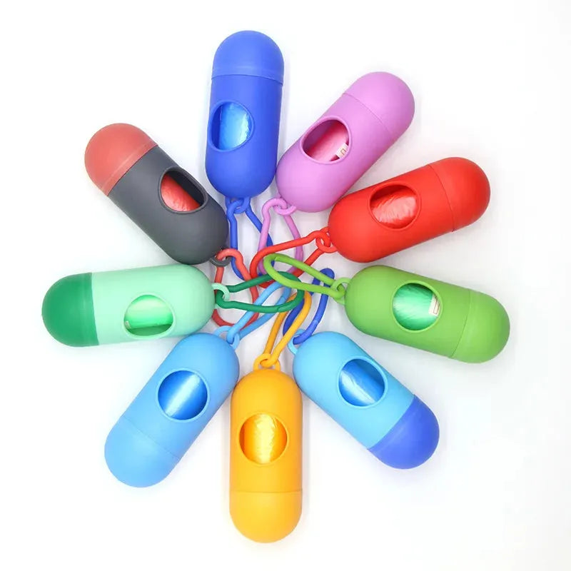Colorful capsule-shaped portable waste bag dispensers with clips, ideal for diapers or pet waste.