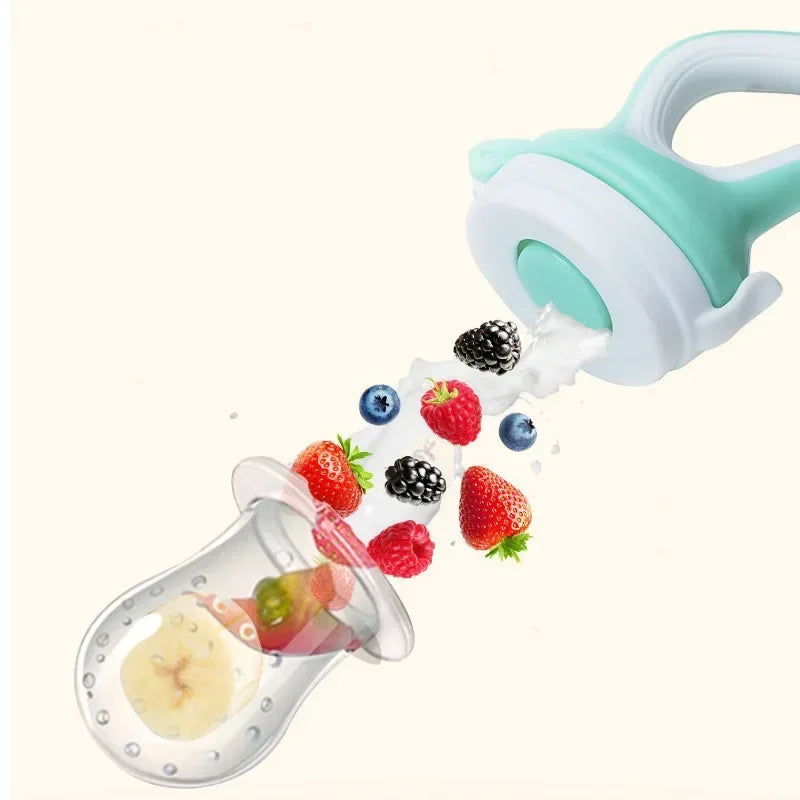 Mint green silicone baby fruit feeder with fresh berries and banana.