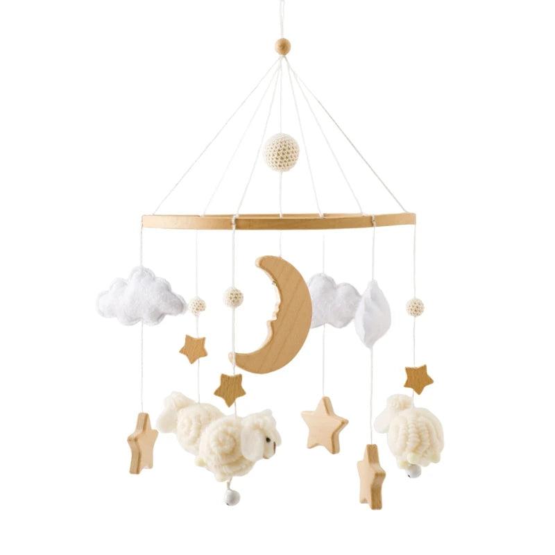 Wooden crib mobile with felt sheep, clouds, moon, and stars in natural and white colors.