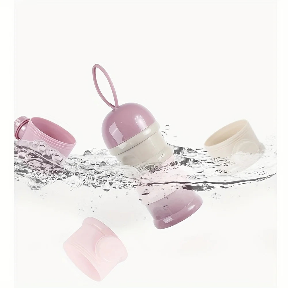 Pink and beige modular baby formula dispenser with handle, floating in water.
