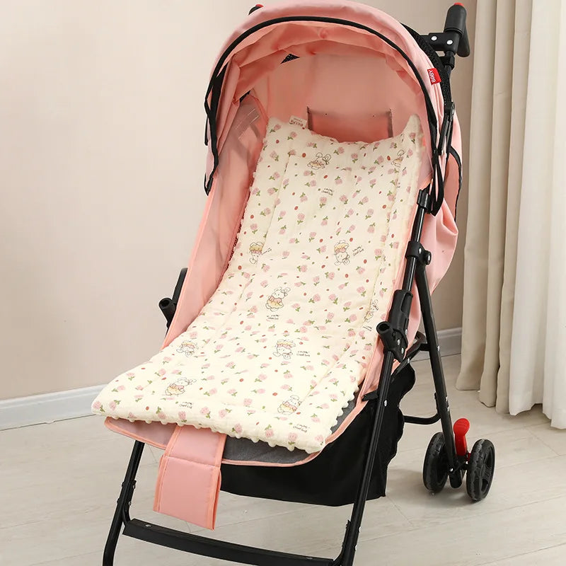 Soft pink baby stroller cushion with cute animal and floral print, enhancing comfort.